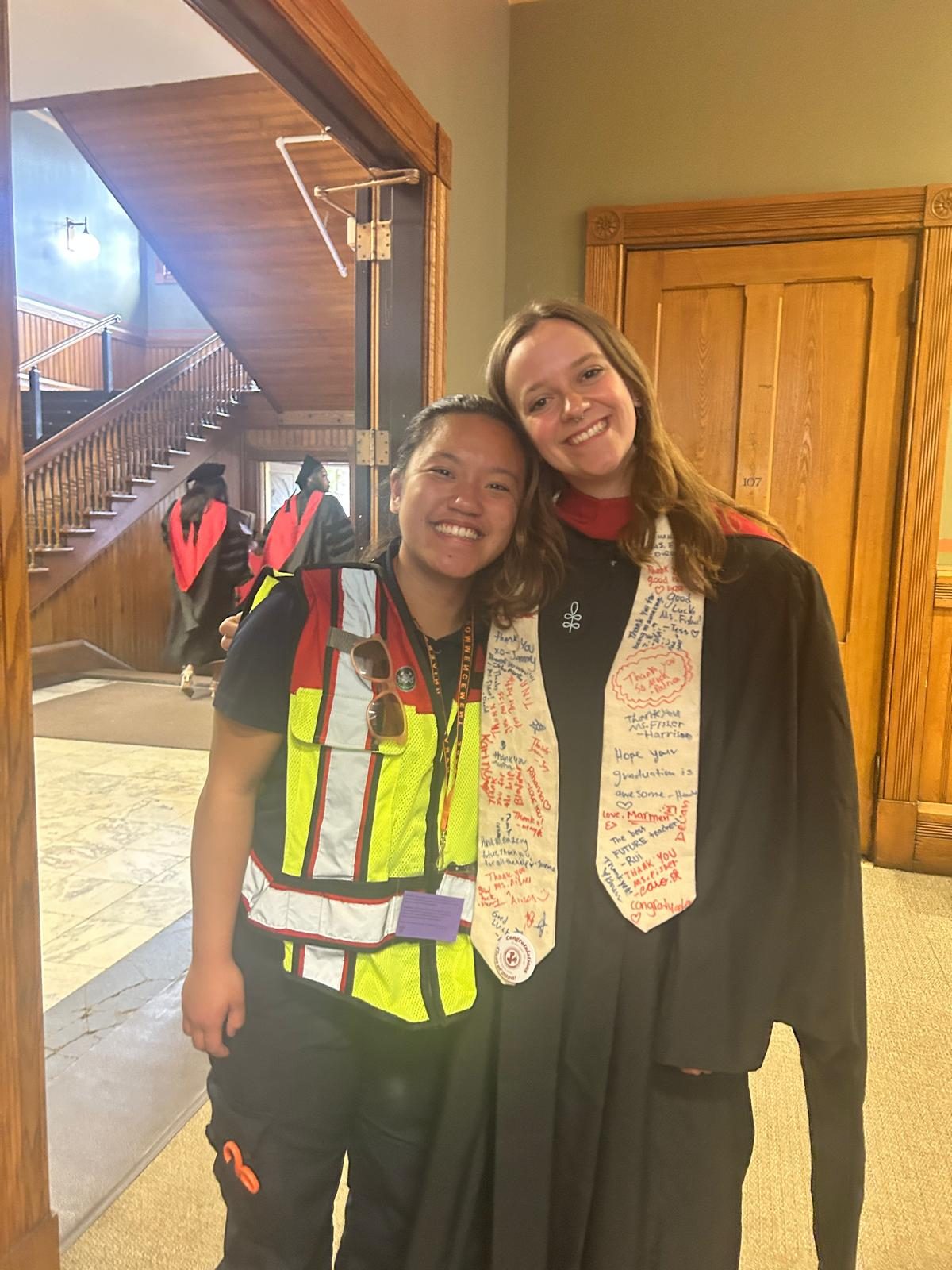 Sofia in CrimsonEMS gear with a friend at graduation